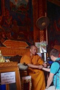 Andrew getting blessed by a monk